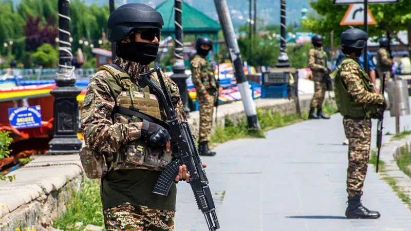 Indian security officials stand guard near Dal lake in Srinagar